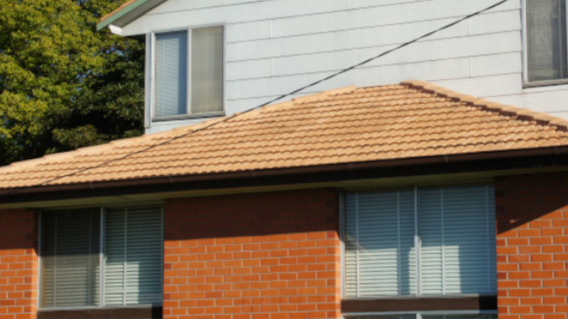 Cement roof after moss treatment, showing clean surface