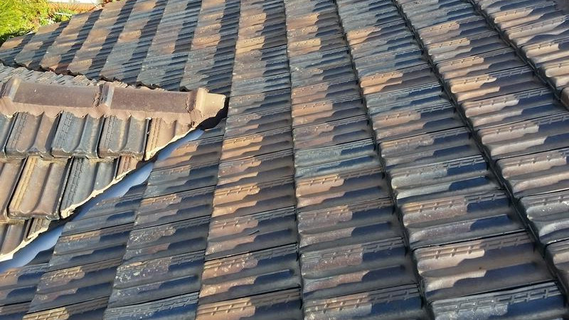Cement roof after moss treatment, showing clean surface